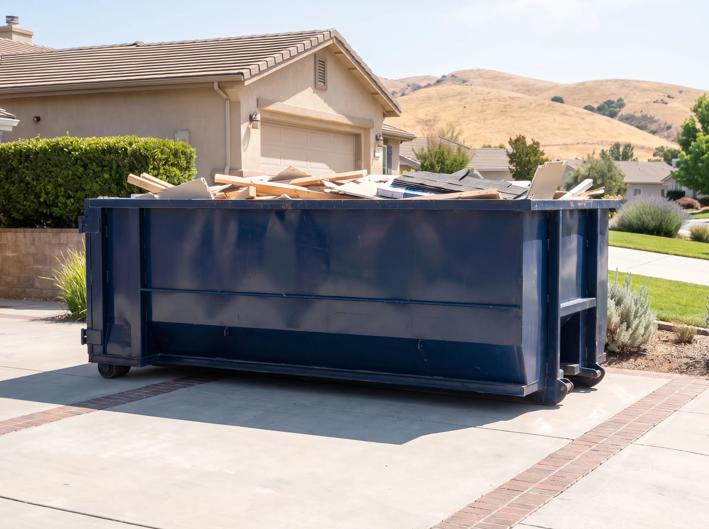 Roll-off dumpster being loaded in San Mateo County, CA